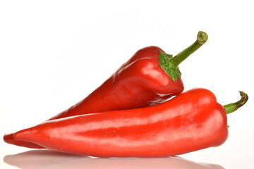 Red organic bell peppers, close-up, on a white background.