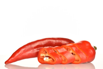 Red organic bell peppers, close-up, on a white background.