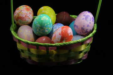 Variety of Colored Eggs in a Basket