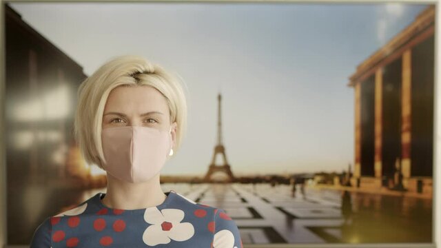 Portrait of a Beautiful Blonde Haired Young Woman Wearing Protective Medical Face Mask and Standing in front of the Eiffel Tower. Safe and Happy Woman Practicing Social Distancing.
