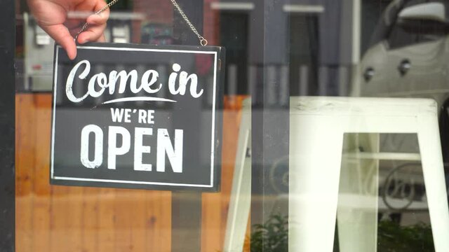 Come in we're open, vintage black retro sign in cafe.