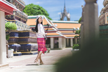 Journey girl in temple of thailand