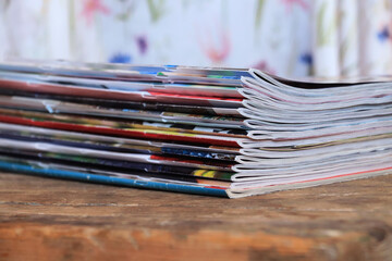 Old magazines on wooden table	