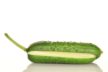 Fresh green cucumbers, close-up, isolated on white.