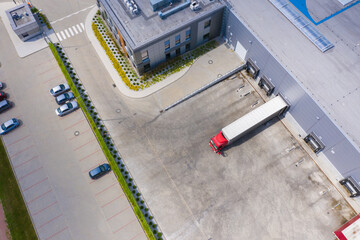Aerial view of goods warehouse. Logistics center in industrial city zone from above. Aerial view of...