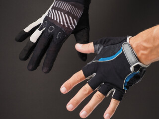 Close-up of men's hands in different Cycling gloves.