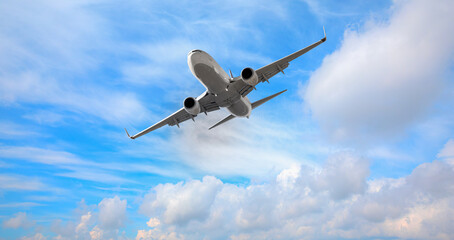 White passenger airplane in the clouds  - Travel by air transport