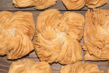 top view of table with fried sweet potato and quince cakes, traditional Argentine