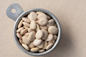 Uncooked Lima Beans in a Measuring Cup