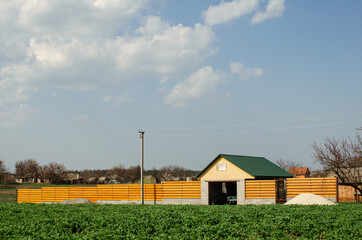 houses in the distance, field