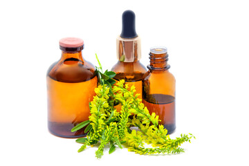Melilotus officinalis flowers and pharmaceutical bottles on white