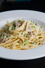 Pasta with meatballs, marinara sauce, Parmesan cheese and fresh Italian parsley. Classic American or Italian restaurant favorite. Homemade pasta with sauces, meats and cheeses.