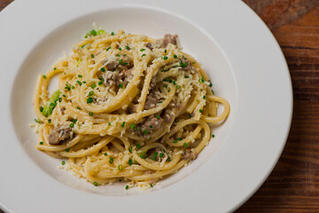 Pasta with meatballs, marinara sauce, Parmesan cheese and fresh Italian parsley. Classic American or Italian restaurant favorite. Homemade pasta with sauces, meats and cheeses.