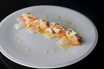 Lobster ceviche. Ceviche made with fresh diced seafood, shrimp, scallops, sea bass and lobster marinated in lime juice, cilantro, jalapeños, salsa salt and pepper. Served with fried tortilla chips.