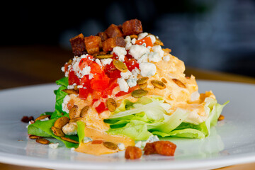 Salad. Classic American or French restaurant salad made w/ kale, Arugula, almonds, blueberries, walnuts, tomatoes, bacon, blue cheese, avocado, tossed w/ olive oil.
