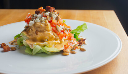 Salad. Classic American or French restaurant salad made w/ kale, Arugula, almonds, blueberries, walnuts, tomatoes, bacon, blue cheese, avocado, tossed w/ olive oil.