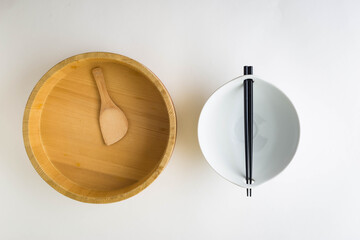 White Asian Bowl with Chopsticks and Japanese Wooden Hangiri Sushi Oke Rice Mixing Bowl with a Spoon
