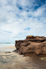 Fototapeta na wymiar Coffee rocks made of sand on the beach at Fraser Island, Queensland, Australia.