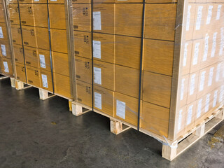Shipment cartons box on pallets and wooden case on hand lift in interior warehouse cargo for export and sorting goods in freight logistics and transportation industrial