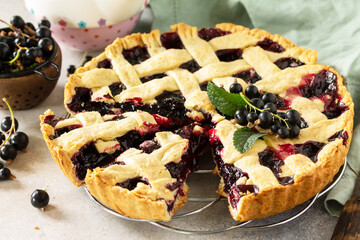 Delicious Berry pie summer with currant. Sweet pie, tart with fresh berry currant on stone countertop.