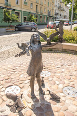 Częstochowa, Poland, June 23, 2020: Closed, due to the Covid-19 pandemic, street fountain with a figure of a girl with birds on the Avenue of the Blessed Virgin Mary © rparys