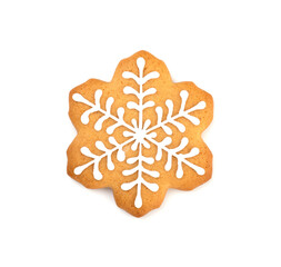 Christmas ginger and honey cookies snowflake shape covered with icing isolated on a white background