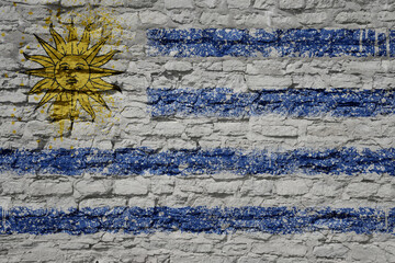 painted big national flag of uruguay on a massive old brick wall