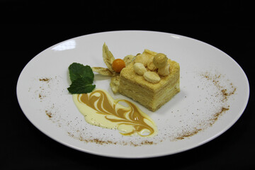  Napaleon cake with mint and nuts on the plate