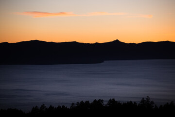 Lake Tahoe sunset with a single skinny cloud. 