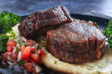Beef medallions with tomato salsa and cream polenta