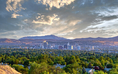 Downtown City of Reno cityscape with hotels and casinos and a dramatic sunrise.
