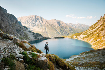Back view of male tourist hiking in Tatra mountains