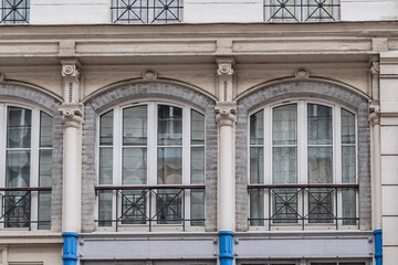 Fototapeta premium Old French house with traditional balconies and windows. Paris, France.