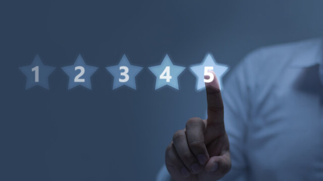 Five stars (5) rating with a businessman touching screen, concept about positive customer feedback and review, excellent performance