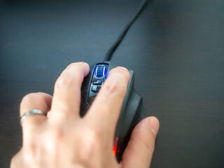 hand with fingers clicking on the mouse