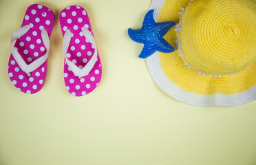 Beach accessories on a yellow background summer and the sea are ready