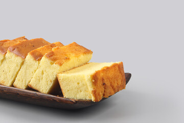 Home made  fresh sponge sliced cakes on wooden tray