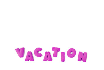 Text of VACATION spelled with purple alphabet shaped biscuits on a white background	
