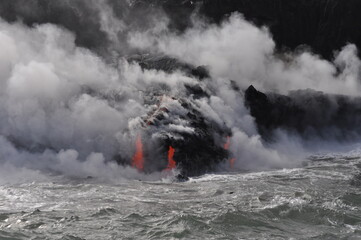 Fototapeta na wymiar Kilauea volcanic flow meets the sea