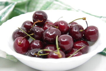 Cherries. Cherries in a White Ceramic Bowl. Fresh red cherries.