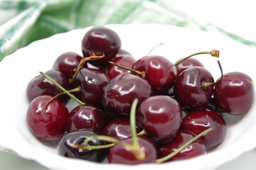 Cherries. Cherries in a White Ceramic Bowl. Fresh red cherries.