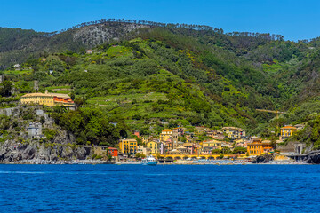 Fototapeta premium A view from the sea toward the old district of Monterosso, Italy in the summertime