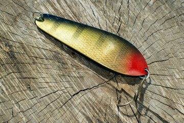 fishing spoon on a wooden table