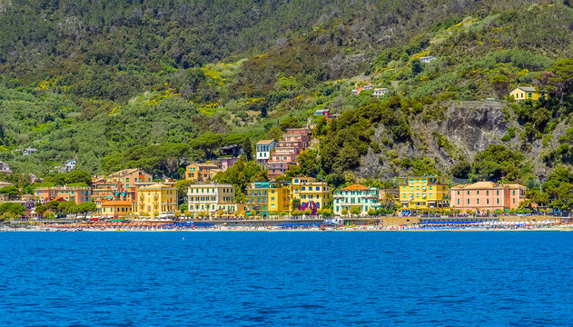 A view along the beach of Monterosso, Italy in the summertime