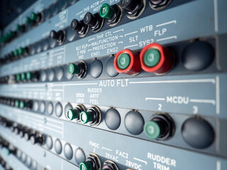 Auto flight circuit breaker panel close up. switch below this title are related to auto flight.
