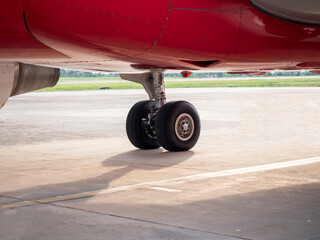 right main landing gear on ground at sunset. copy space provided.