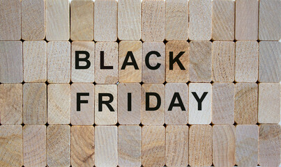 Wooden blocks form the words 'black friday'. Beautiful wooden background. Business concept.