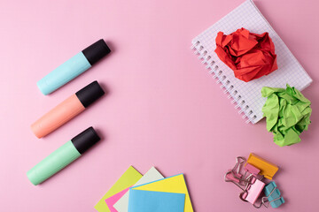 different stationary items on pink. flat lay