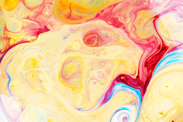 Fluid Art. Abstract blurred multi-colored background. Swirl liquid pattern. Trendy colorful backdrop. Mixing paints