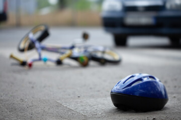 Close-up of car crash with bicycle on the road